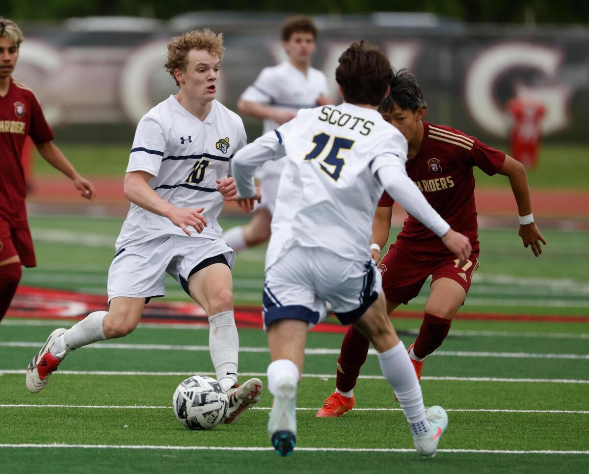 Highland Park striker Jake Rhine (10) attempts to keep the ball away from Saginaw Pelun Adam (17) during the Class 5A D2 UIL state semifinal boys soccer playoff game at Buddy Echols Field in Coppell, Texas, Saturday, Apr. 05, 2025.
