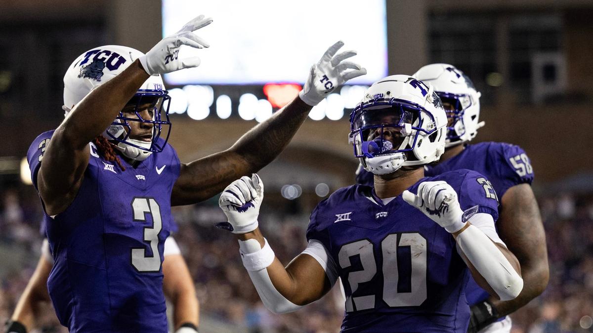 TCU running back Dominique Robinson (20) celebrates after scoring a touchdown with wide receiver Savion Williams (3) in the second quarter of a non-conference NCAA game between Long Island University and Texas Christian University at Amon G Carter Stadium in Fort Worth on Saturday.