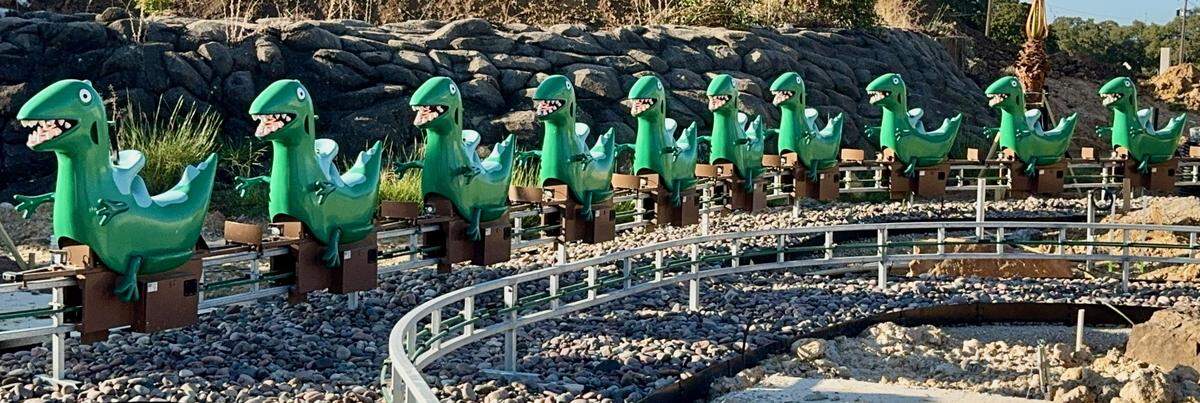 Grampy Rabbit’s Dinosaur Adventure takes riders along a track, passing smoky volcanoes and Peppa Pig characters.
