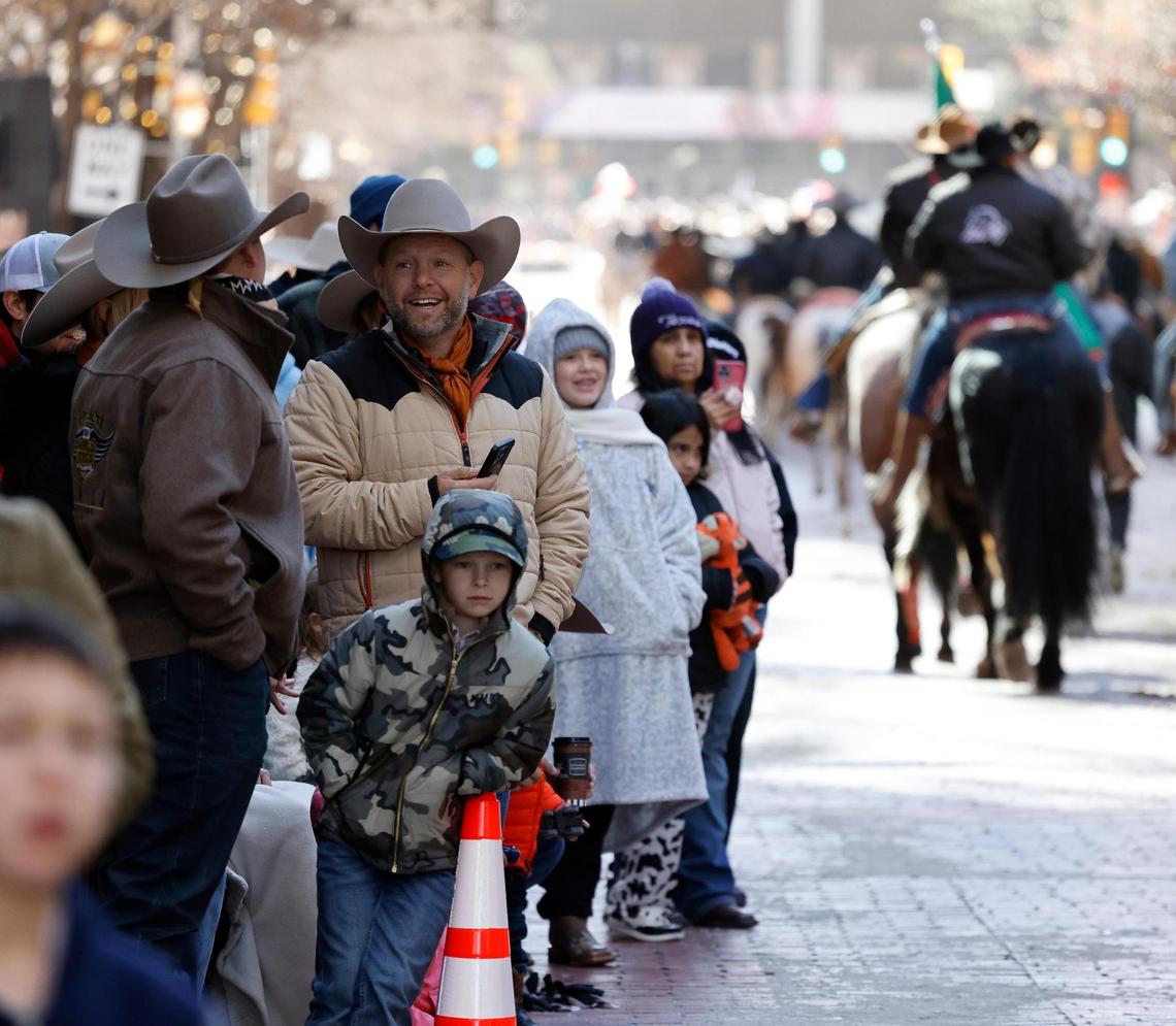 Parade goers bundled up and watched the Fort Worth Stock Show and Rodeo parade in Fort Worth, Texas, Saturday, Jan, 13, 2024. The temperature at the start of the parade was 42. (Special to the Star-Telegram Bob Booth)
