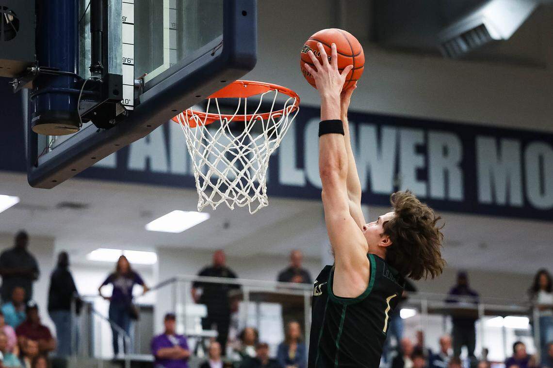 Birdville forward Sawyer Dotson (1) goes up to the rim for a dunk on a fast break against Denton in a UIL Class 5A Division I regional final at Flower Mound High School in Flower Mound, Texas, Friday, March 6, 2026.