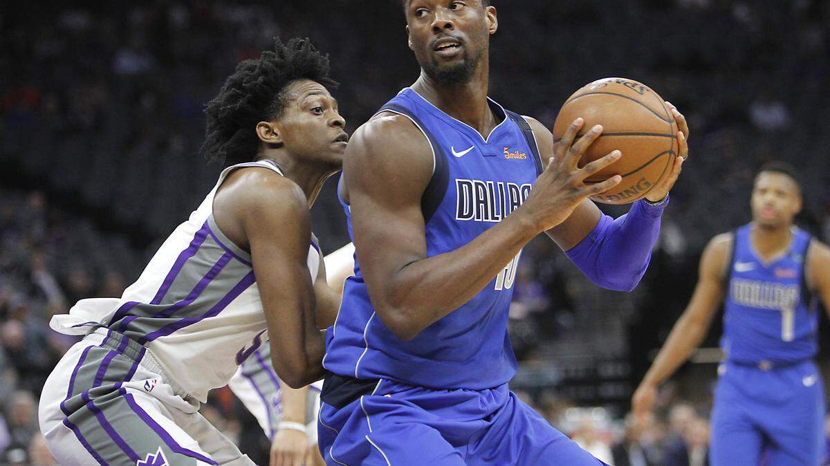 Mavericks forward Harrison Barnes (40) works for position against Sacramento Kings guard De'Aaron Fox. The NBA draft is less than 48 hours away, and more trade rumors involving the Dallas Mavericks continue to circulate.