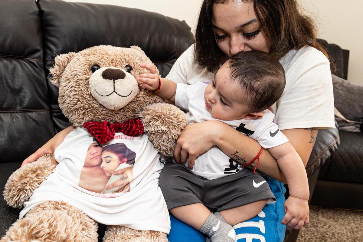 Corina Camacho and her son cuddle a teddy bear showing her and the child’s father, Zechariah Trevino. When he found out she was pregnant, he was elated. “I know he’s talking God’s ear off right now,” she said.