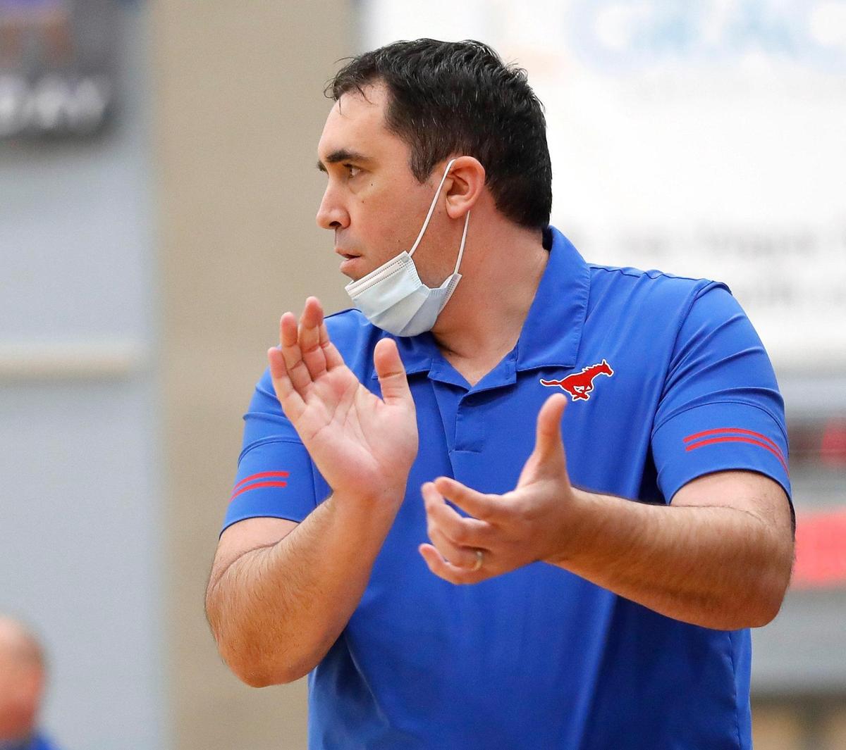 Grapevine head coach Michael Seibert applauds his teams play during the first half of a 5A Region 1 bi-district basketball game at Brewer High School in Fort Worth, Texas, Monday, Feb. 22, 2021. Grapevine led Brewer by two at the half. (Special to the Star-Telegram Bob Booth)