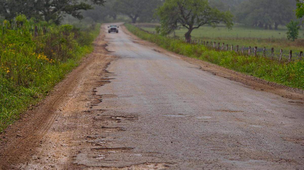 A badly damaged section of road near Cheapside, between Gonzales and Cuero, on April 10, 2018.