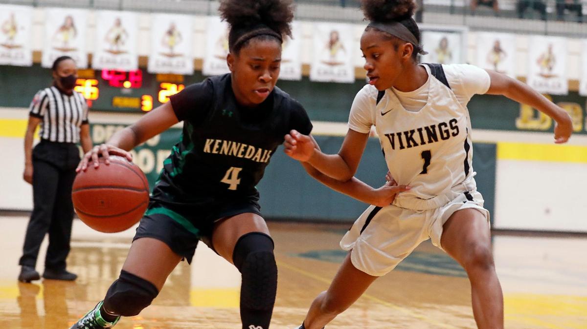 Kennedale guard Jayla Jackson-Allen (4) drives to the paint defended by Pinkston guard Dajarae Thomas (1) during the second half of a 4A Region 2 quarterfinal basketball game at DeSoto High School in DeSoto, Texas, Wednesday, Feb. 24, 2021. Pinkston defeated Kennedale 47-38. (Special to the Star-Telegram Bob Booth)
