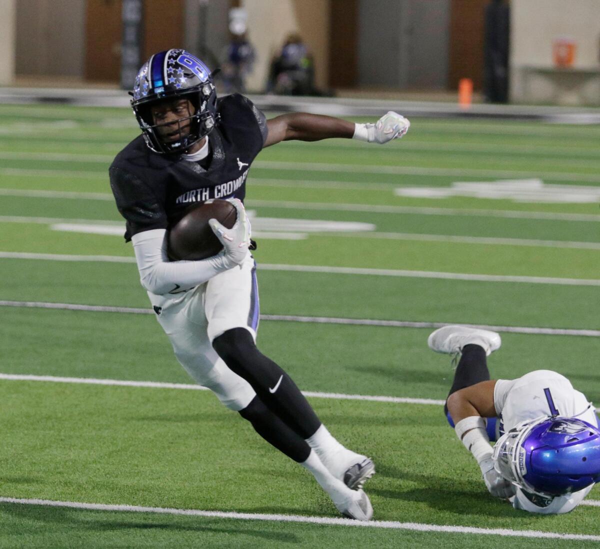 North Crowley’s Quentin Gibson finds a hole during a UIL football game at Crowley ISD Multi Purpose Stadium on Friday, October 18, 2024.