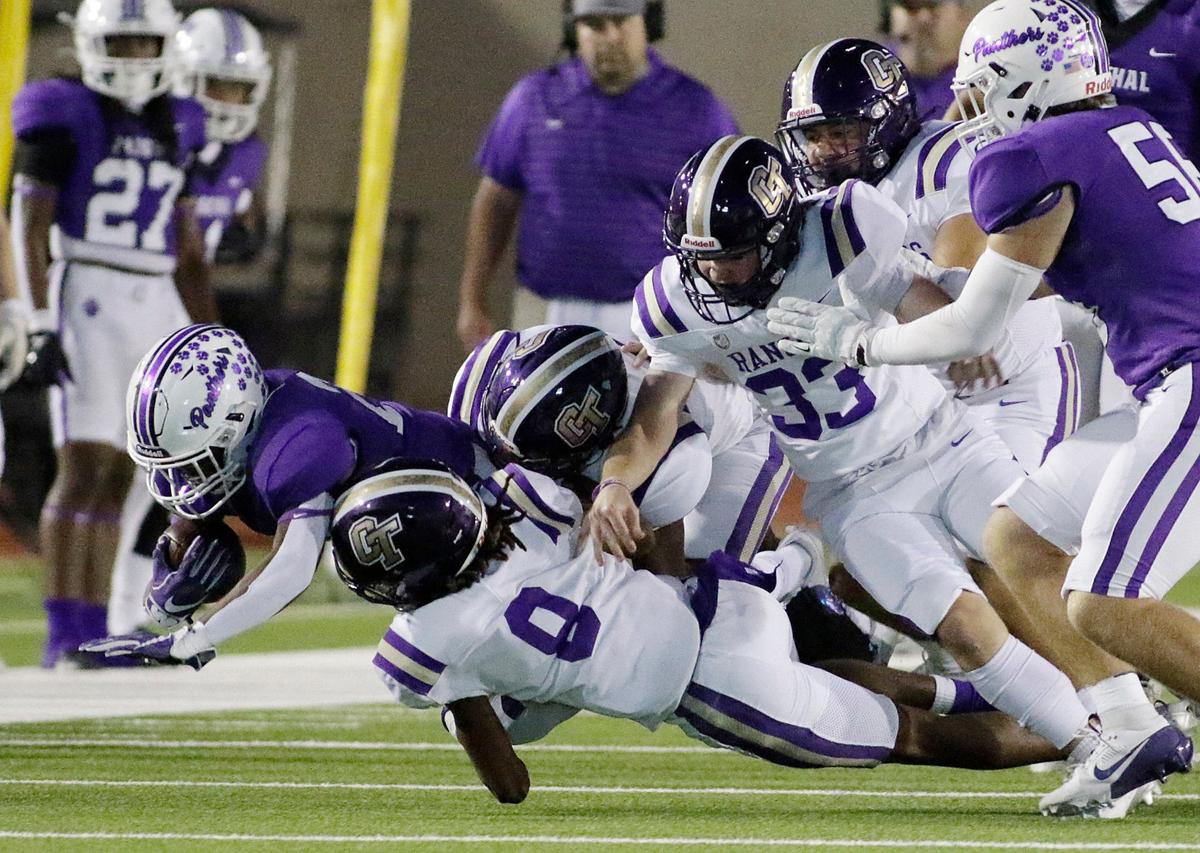 Pashal’s Maki Gee is buried under a host of Chisholm Trail tacklers during a UIL football game at Farrington Field Stadium on Thursday, October 4, 2024.
