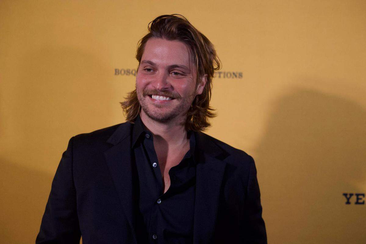 A smiling Luke Grimes walked down the red carpet event before Yellowstone premiere Sunday, Nov. 13, 2022, at Hotel Drover in Fort Worth.