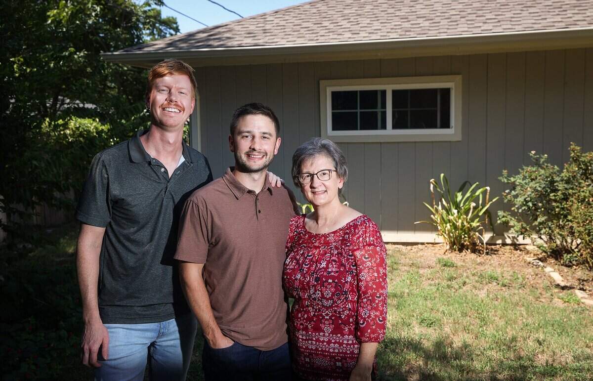 Jacob Johnson, center, started his candle company Calyan Candles in a bedroom of his mother's home, eventually moving to the detached shed, shown here. Johnson's mission is to contribute to the cause of ending human trafficking by giving back a percentage of his sales to anti trafficking organizations.Pictured is Stephen Engstrom, one of Calyan's first employees, left, Jacob Johnson, Center, and his mother Vivian.