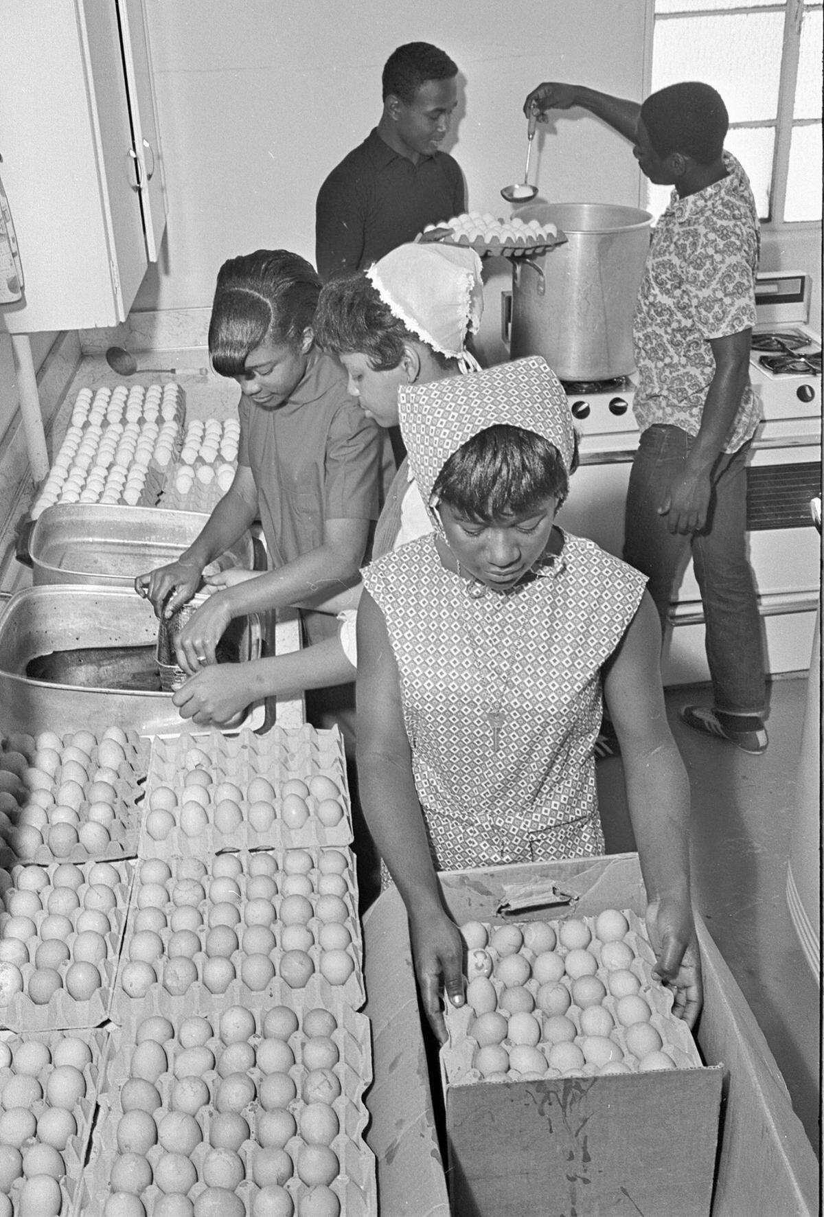 YMCA Leadership Program volunteers boiled and dyed over 3,800 eggs at the Harmon Recreation Center for 1968 Easter egg hunts at Lake Como and Sycamore Park. Volunteers included, from front to rear: Patricia Smothers, Roy Doris Freeman, Barbara Martin, Donald Graham, and Robert Whigam.