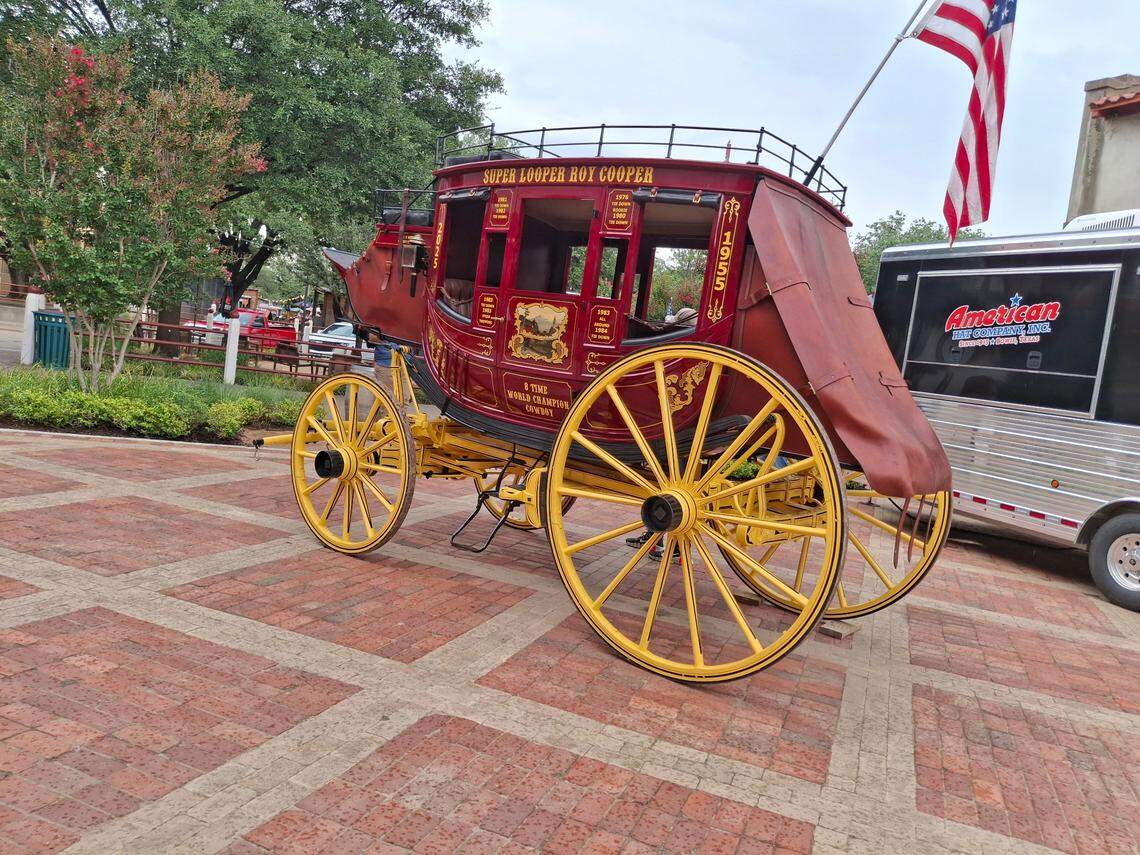 Roy Dale Cooper’s eight world championships and his title “Super Looper” are displayed on a stagecoach outside the Cowtown Coliseum in Fort Worth where Cooper’s memorial service was held on Monday.