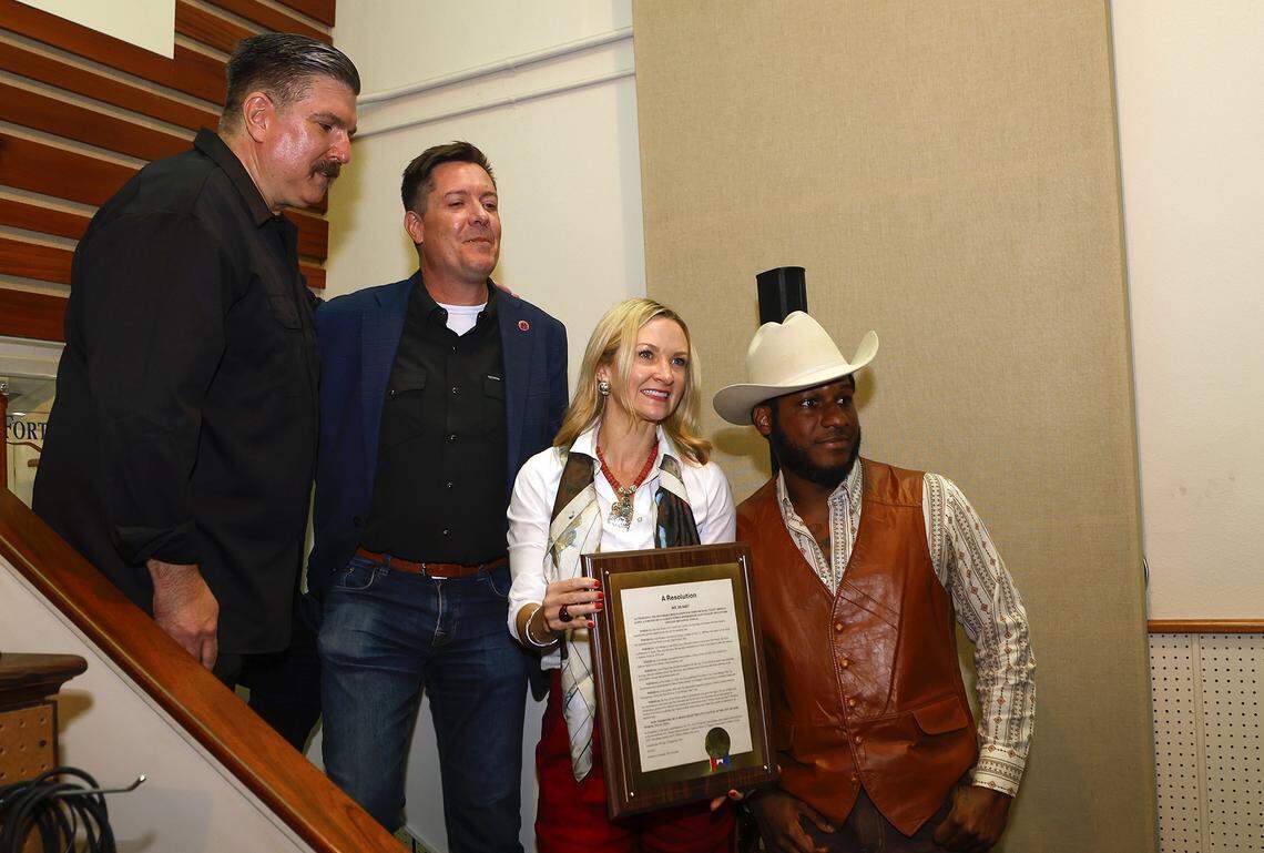 Leon Bridges, far right, takes a photograph with Tom Martens, director of Hear Fort Worth Music Office, left, Chip Adams, director of the Texas Music Office, second from left, and Mayor Mattie Parker on Tuesday, Oct. 7, 2025, at Nile City Sound. Bridges was honored with a ceremonial street naming on South Calhoun Street.
