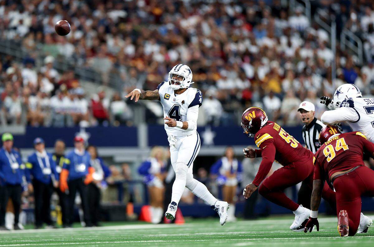 Dallas Cowboys quarterback Dak Prescott threw for 264 yards and three touchdowns against the Washington Commanders on Sunday at AT&T Stadium in Arlington.