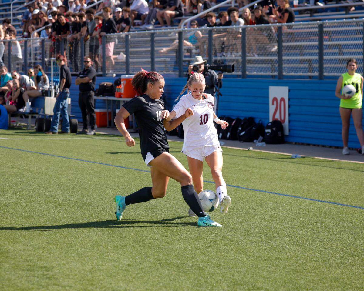 Colleyville Heritage junior forward Landyn Blueitt compete for a possession in the girls’ Class 5A Division 1 UIL high school soccer state championship vs. College Station A&M Consolidated at Birkelbach Field in Georgeown on Friday, April 11, 2025.