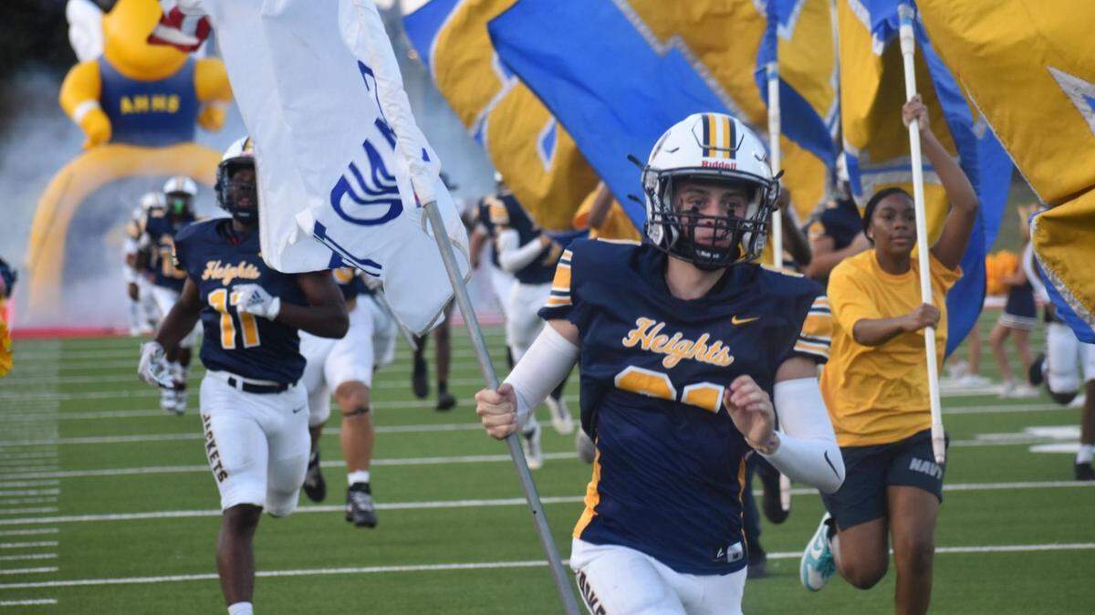 Arlington Heights takes the field to face off against North Side during a high school football game at Farrington Field in Fort Worth, Texas, Friday, September 12, 2025.
