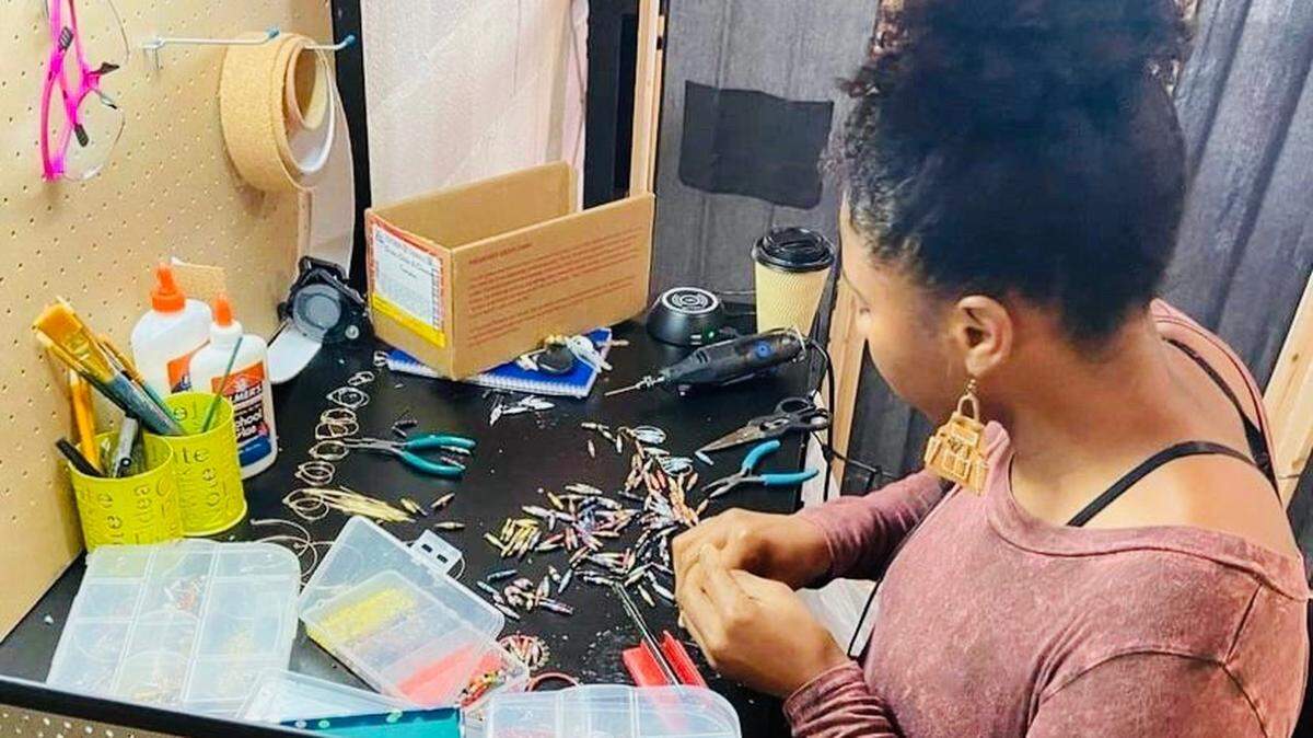 Arlington artist Tschaner Azubuike crafts jewelry made of paper beads, an art form that originated in Uganda. Azubuike will sell her work from noon to 8 p.m. Saturday at West Main Arts Festival in downtown Arlington.