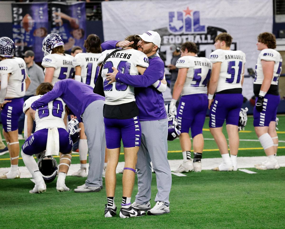 Tolar coaches hugged players on the sidelines after the UIL Conference 2A Division I state championship football game at AT&T Stadium in Arlington, Texas, Wednesday, Dec. 13, 2023. Timpson defeated Tolar 49-7. (Special to the Star-Telegram Bob Booth)