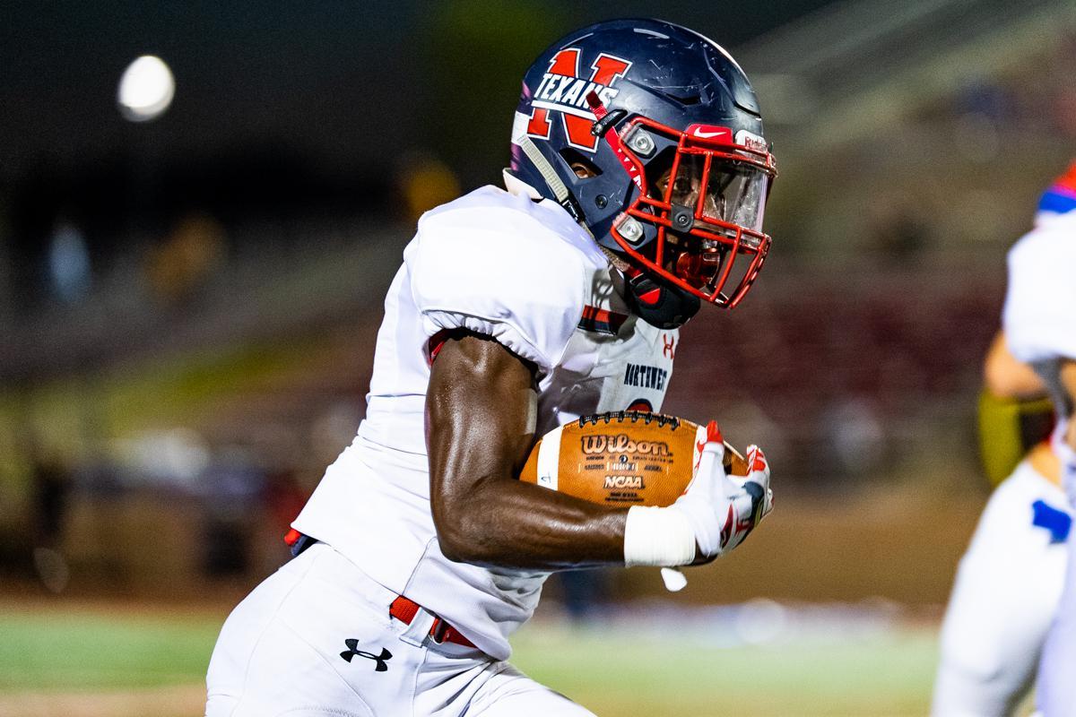 Texan senior #2 Zavion Taylor sprinting down the field.