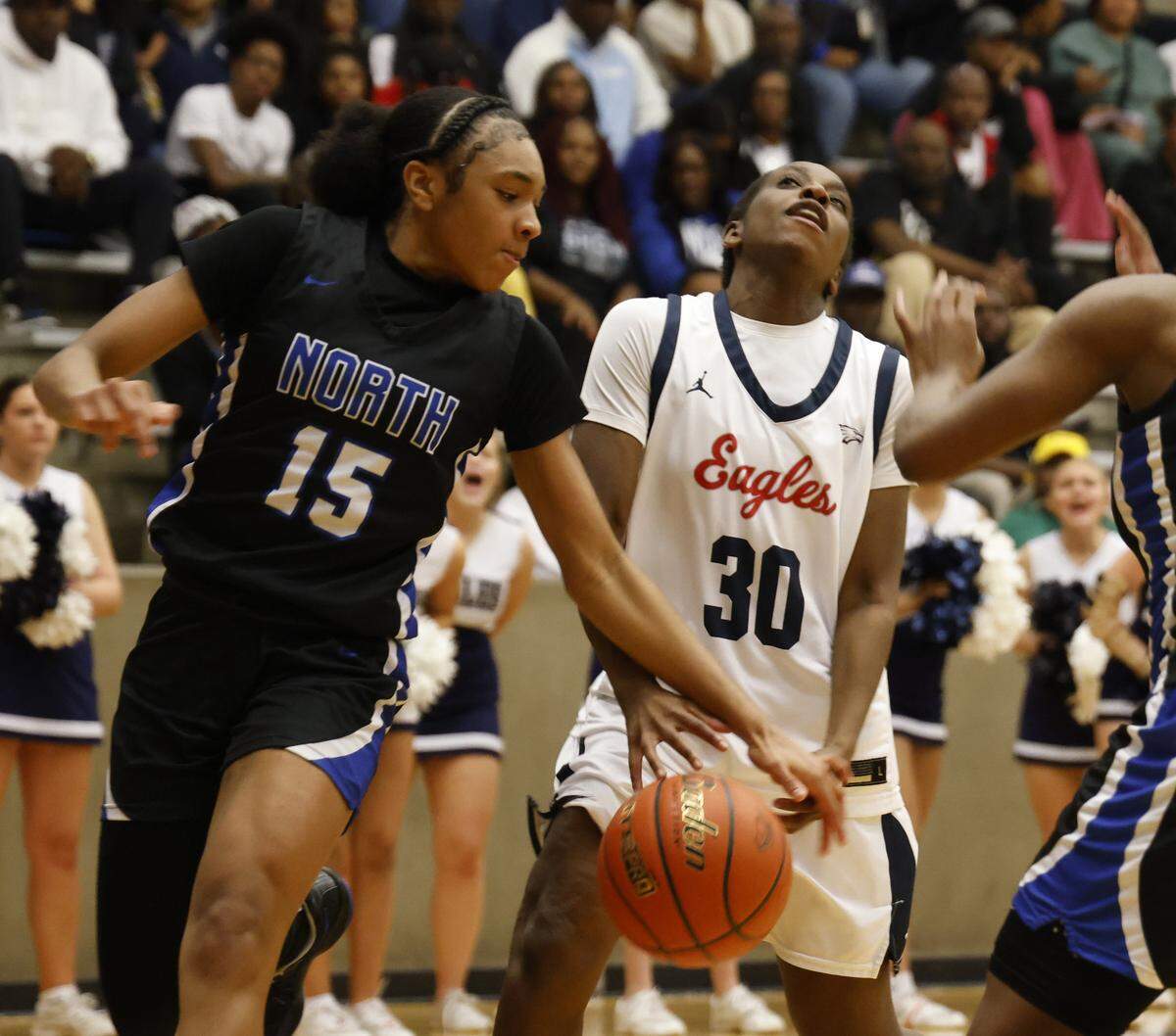 North Crowley guard Sukari Kinney (15) knocks the ball out of the hands of Allen guard Zaria Kyalo (30) during the first half of a UIL Class 6A Division I girls regional semifinals basketball playoff game at Grand Prairie High School in Grand Prairie, Texas, Tuesday Feb. 24, 2026.