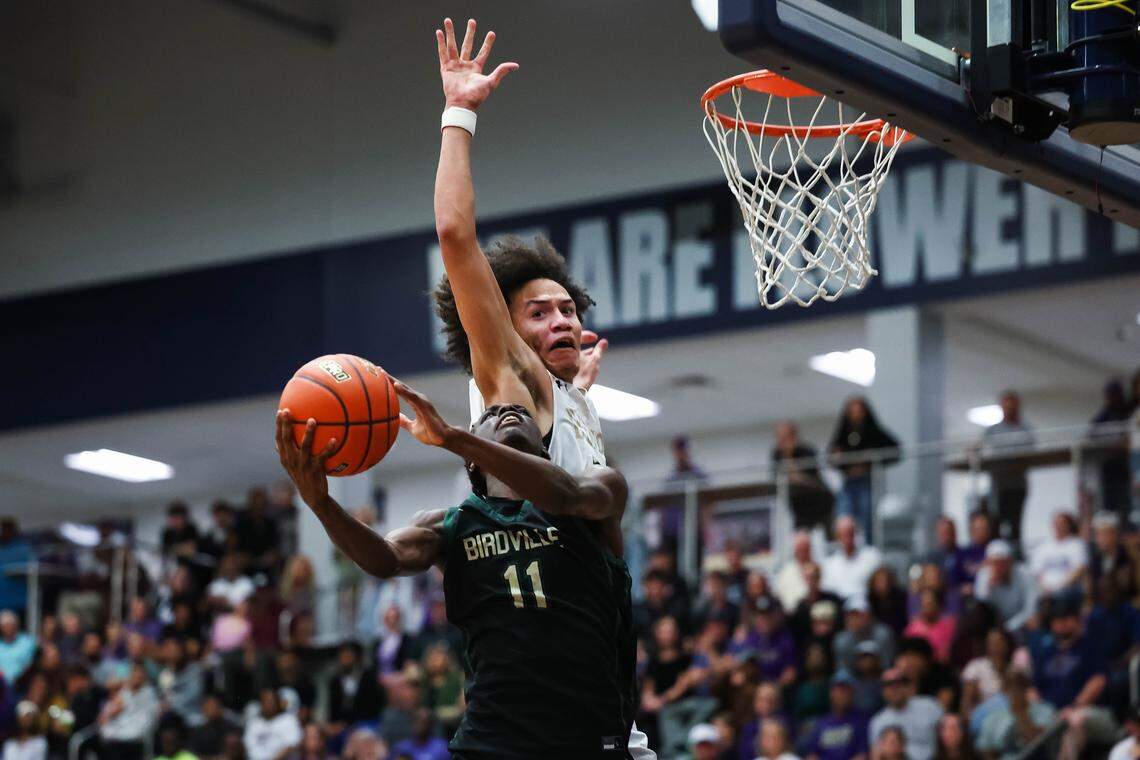 Birdville guard D.J. Driver (11) attempts a shot at the basket as a Denton defender attempts to block the shot in a UIL Class 5A Division I regional final at Flower Mound High School in Flower Mound, Texas, Friday, March 6, 2026.