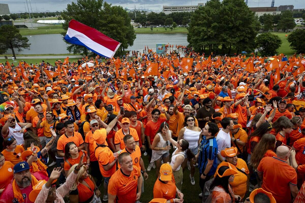 A sea of orange takes over the streets of Arlington before the the FIFA World Cup match between the Netherlands and Japan on Sunday, June 14, 2026 in Arlington, Texas.