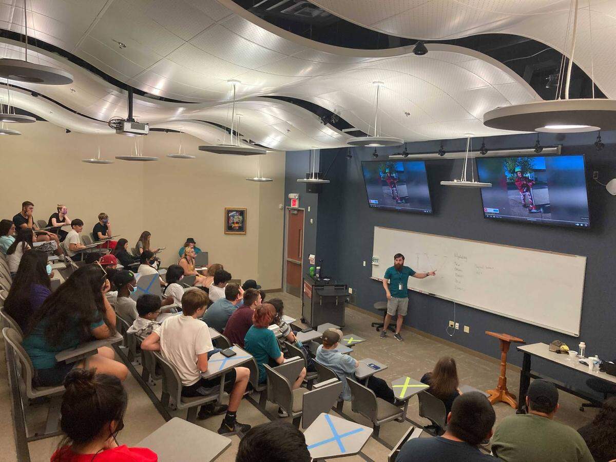 Joseph Cowan, end-of-course assistant director, gives a physics presentation to Opportunity Resource Services Upward Bound students on the campus of Southwestern Adventist University in Keene.