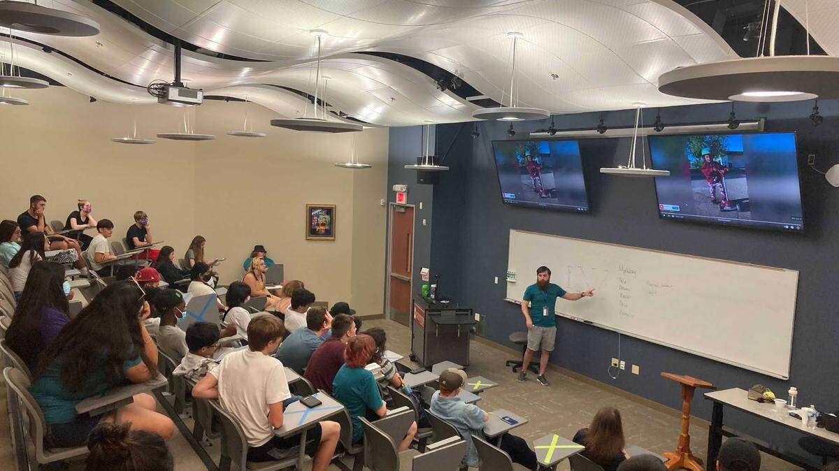 Joseph Cowan, end-of-course assistant director, gives a physics presentation to Opportunity Resource Services Upward Bound students on the campus of Southwestern Adventist University in Keene.
