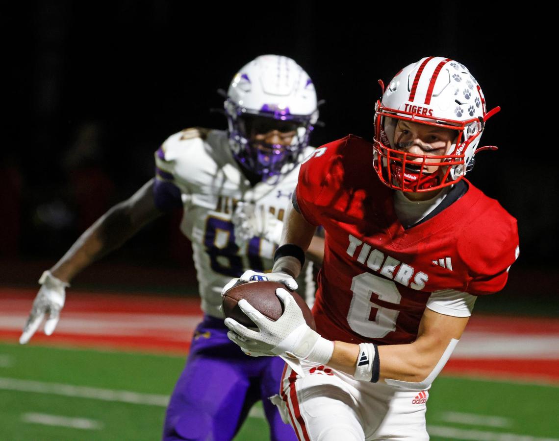Glen Rose defensive back Colton Andress (6) grabs an interception intended for Alvarado wide receiver Jorden Wright (80) during a UIL football game at Tiger Stadium in Glen Rose Texas, Friday, Sept. 27, 2024.