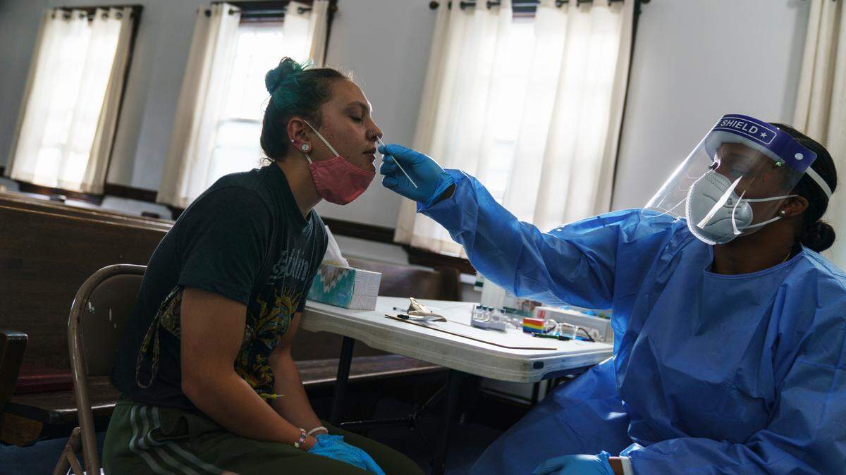 Jessica Leo, left, is tested for COVID-19 at a clinic set up at Bethel AME Church in Providence, R.I. last week. Tarrant County in North Texas has opened three more free testing sites in Arlington and Mansfield.