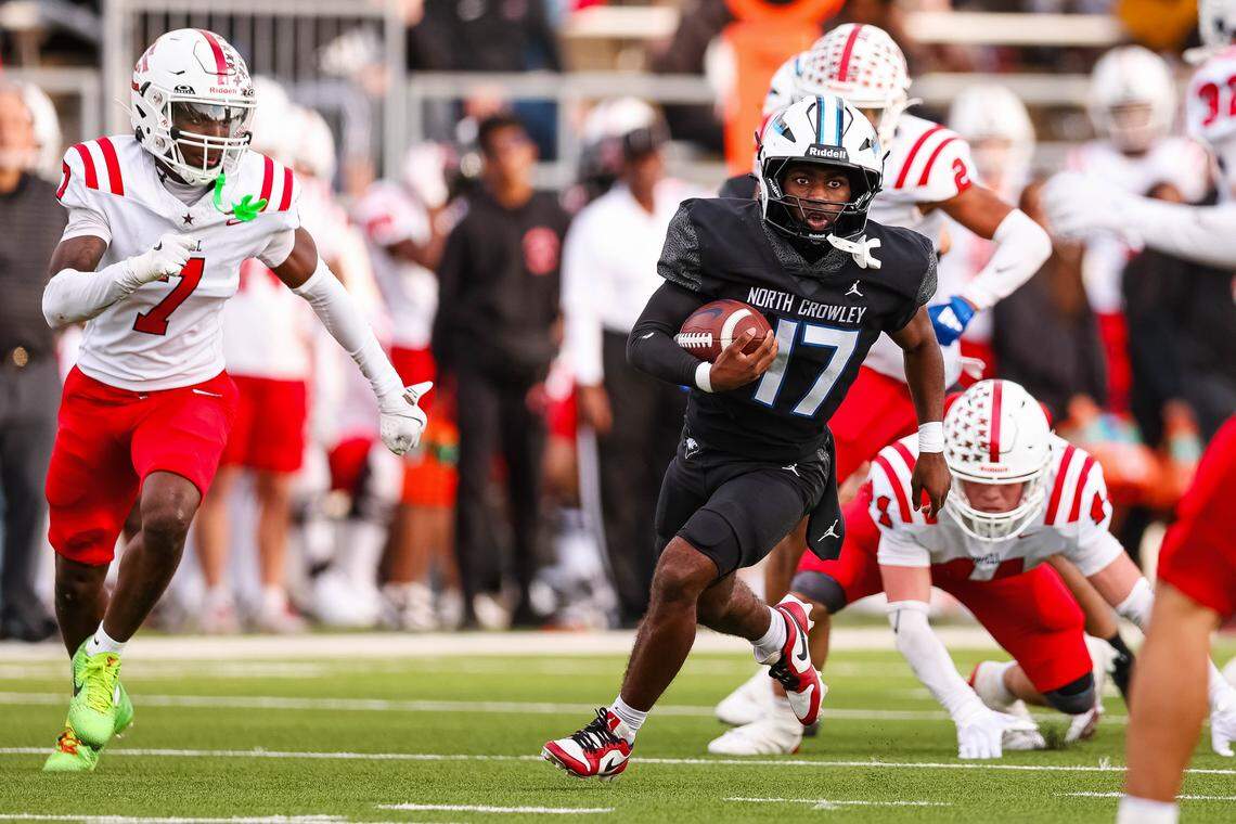 North Crowley running back Marquis Robinson runs with the ball past Coppell defenders in a Class 6A Division I regional playoff Saturday, Nov. 29, 2025, at Midlothian ISD Stadium in Midlothian.