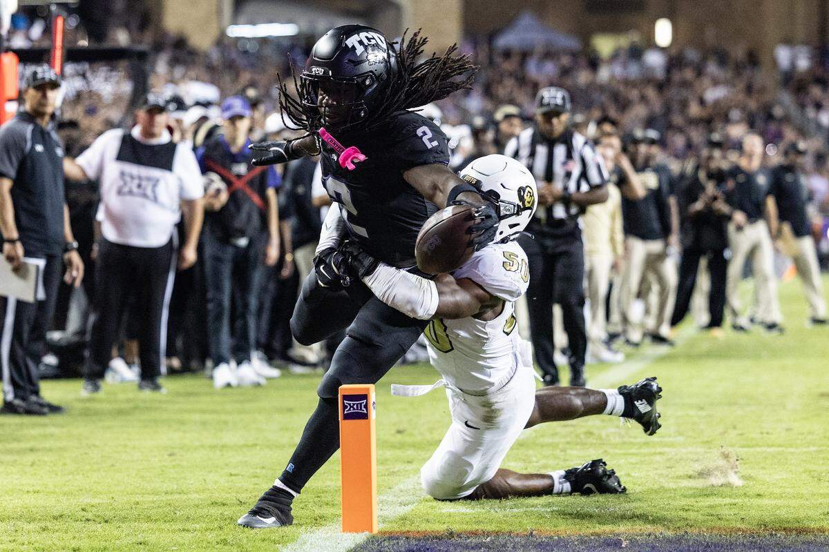 TCU running back Kevorian Barnes (2) is tackled before the end zone by Colorado linebacker Reginald Hughes (50) in the first half of an NCAA football game between TCU and Colorado at Amon G. Carter Stadium in Fort Worth on Saturday, Oct. 4, 2025.