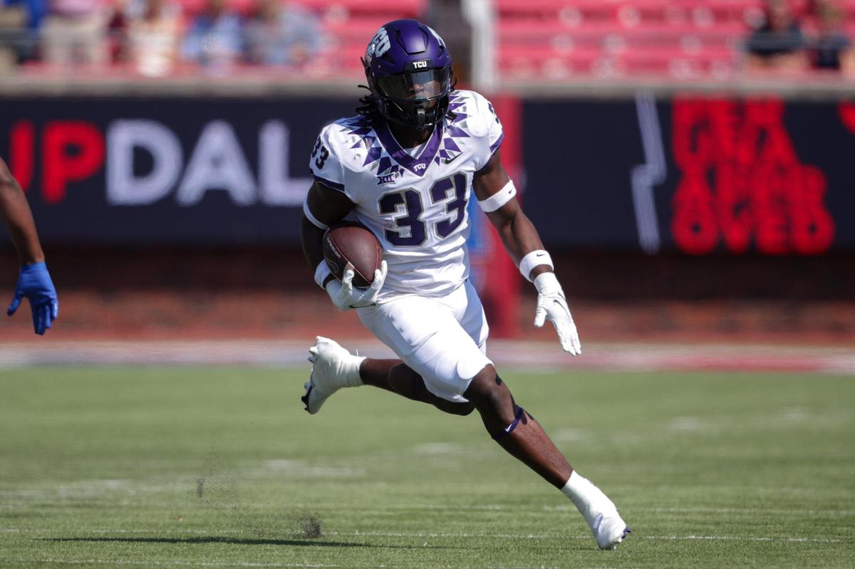 TCU running back Kendre Miller drives the ball down the field on Saturday, Sept. 24, 2022, at the Gerald Ford Stadium in the Southern Methodist University in Dallas, Texas.