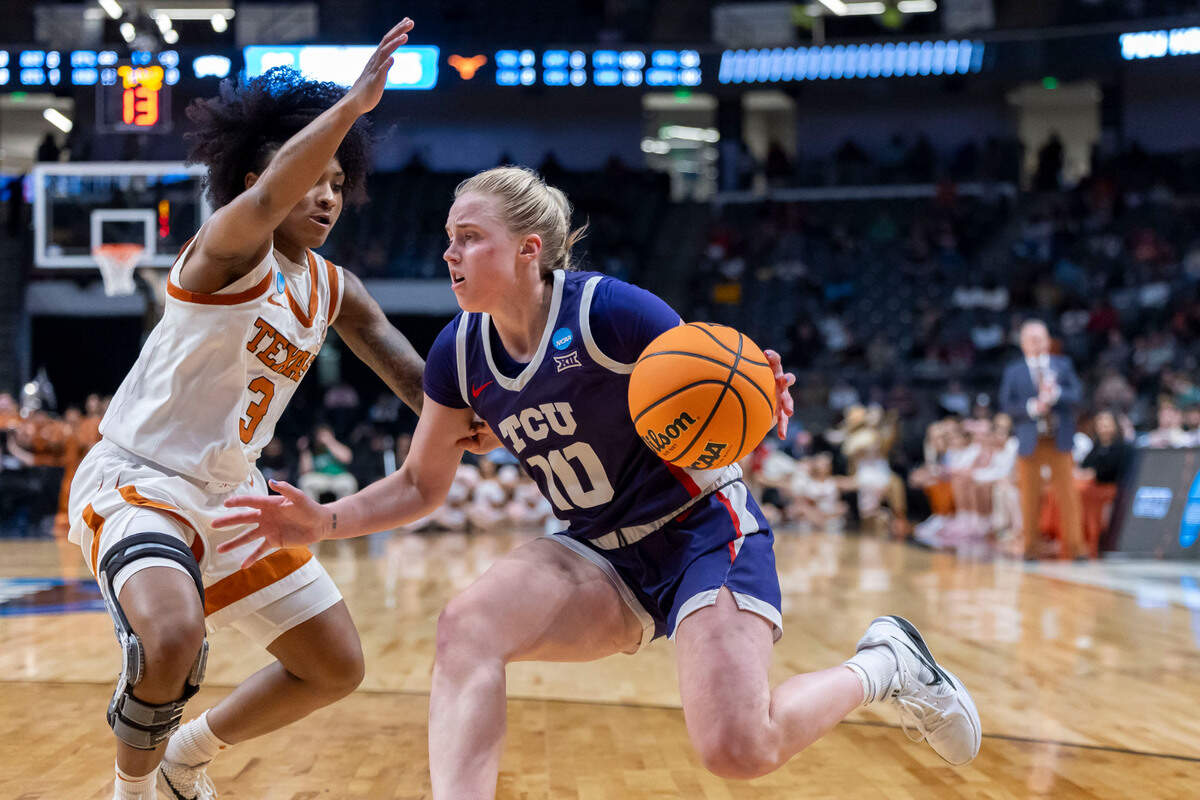 TCU Horned Frogs guard Hailey Van Lith (10) works against Texas Longhorns guard Rori Harmon (3) during the second half of an Elite 8 NCAA Tournament basketball game at Legacy Arena.