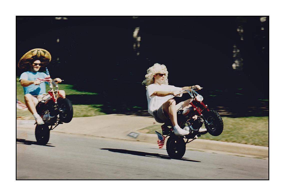 Chris Watson (left) and Craig Knight (right) don a sombrero and Marilyn Monroe wig while riding their Honda minibikes in 1995.