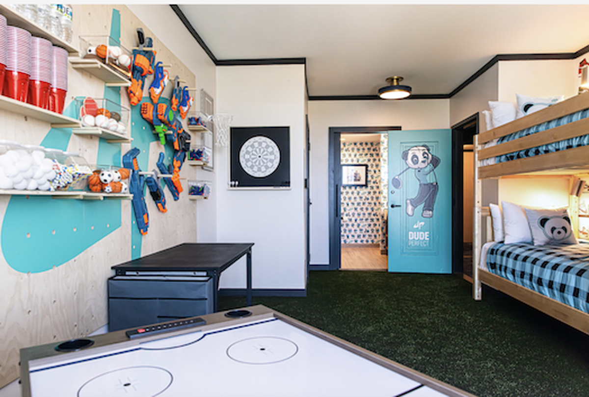The kids room has four bunk beds, complete with a gaming table and magnetic dart board in the Dude Perfect suite at the Omni PGA Frisco hotel.