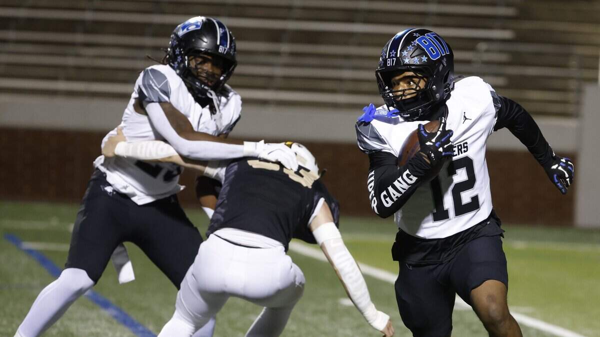 North Crowley wide receiver Kade Smith (12) works his way out of the backfield during the first half of a UIL football game between North Crowley and Mansfield at Vernon Newsom Stadium in Mansfield, Texas, Thursday, October, 30, 2025.

