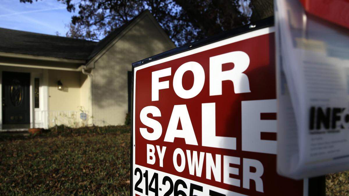 FILE - In this photo Dec. 16, 2014 file photo, a for sale by owner sign sits in front of a home in Richardson, Texas. (AP Photo/LM Otero, File)