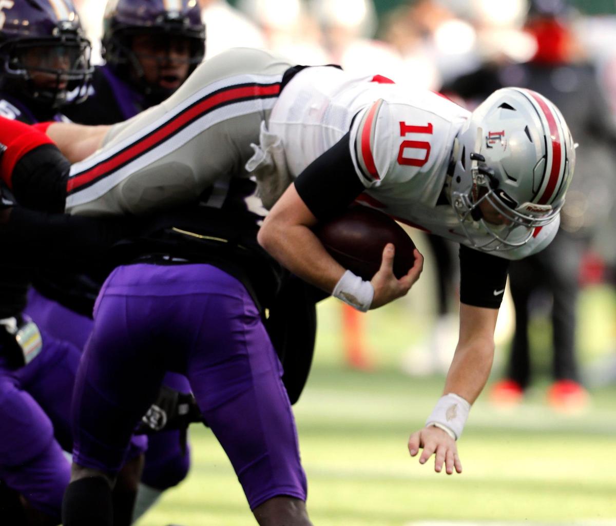 Lovejoy quarterback R.W. Rucker (10) goes up and over for the first down during a Conference 5A Division 2 area round football playoff game at Globe Life Park in Arlington, Texas, Friday, Dec. 18, 2020. Lovejoy led Everman 28-7 at the half. (Special to the Star-Telegram Bob Booth)