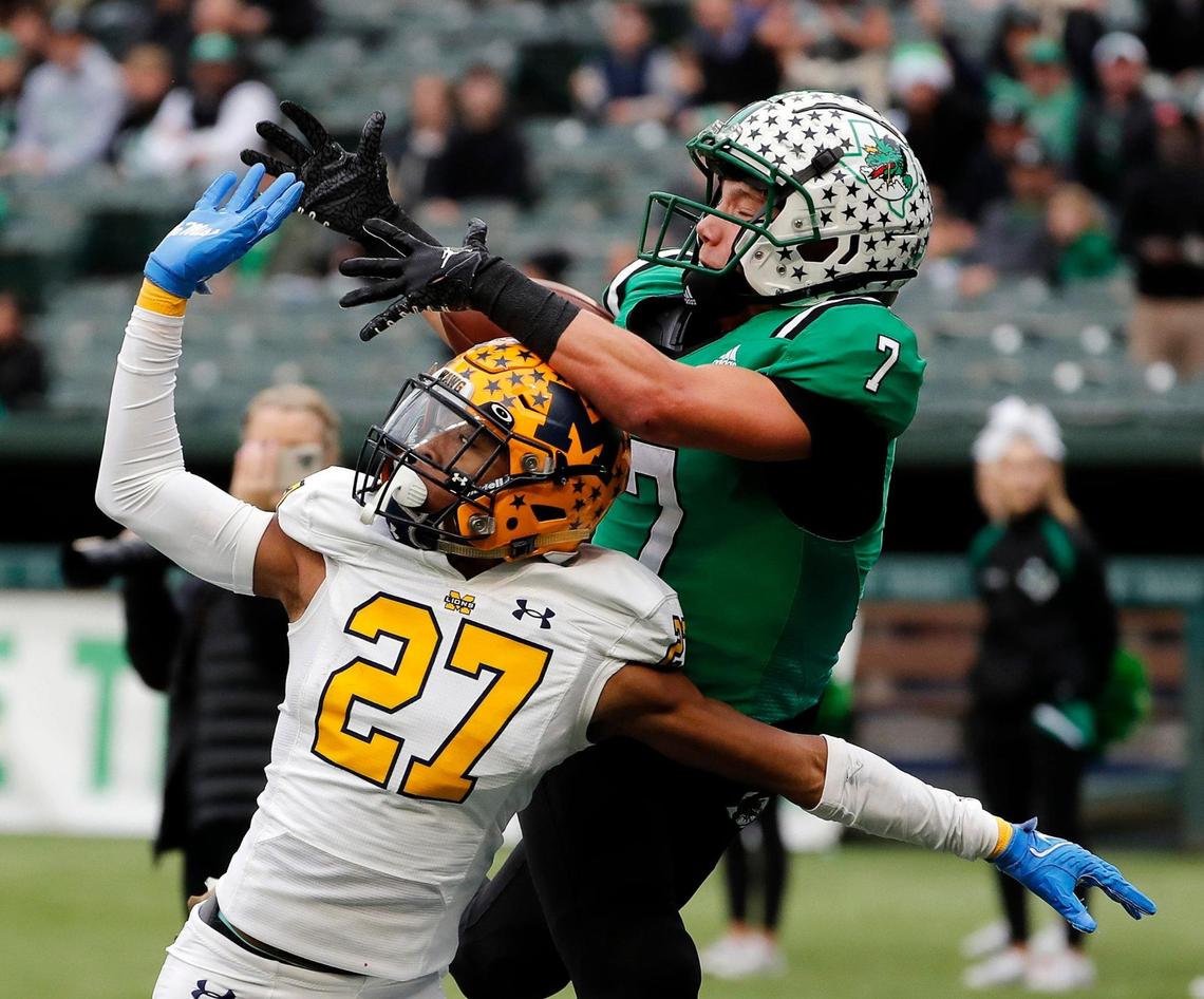 McKinney cornerback Zadian Gentry (27) defends an end zone pass intended for Southlake Carroll wide receiver Jacob Jordan (7) in the first half of Class 6A D2 regional semi-finals football game at Choctaw Stadium in Arlington, Texas, Friday, Nov. 25, 2022. Carroll tied the game at 7 with 28.6 seconds remaining in the half but McKinney stormed back in 21 seconds and made the game 14-7. (Special to the Star-Telegram Bob Booth)
