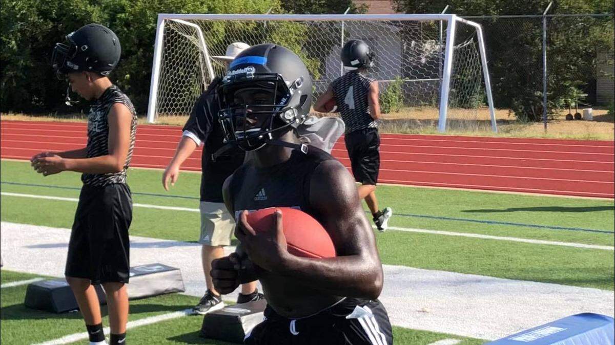 South Hills senior Anthony Watkins goes through running back drills during the Scorpions first practice, Monday August 6, 2018.