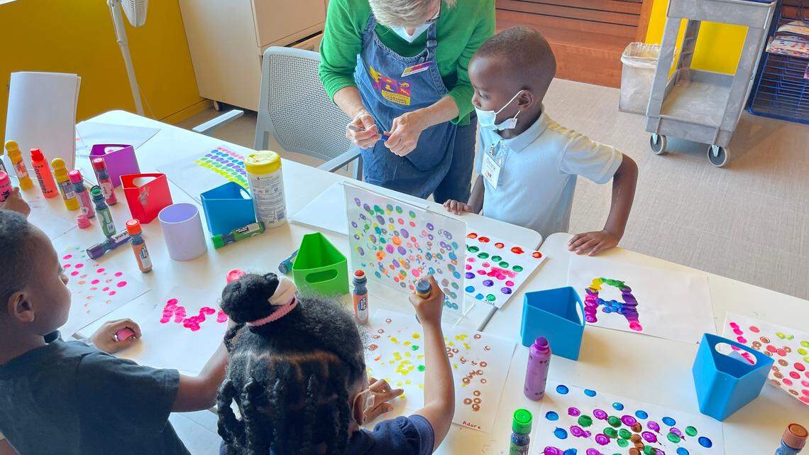 Rhonda Latham, a Fort Worth Museum of Science and History teacher, walks Fort Worth school district students through a craft as part of the Legacy Program, a partnership between the school and the museum.