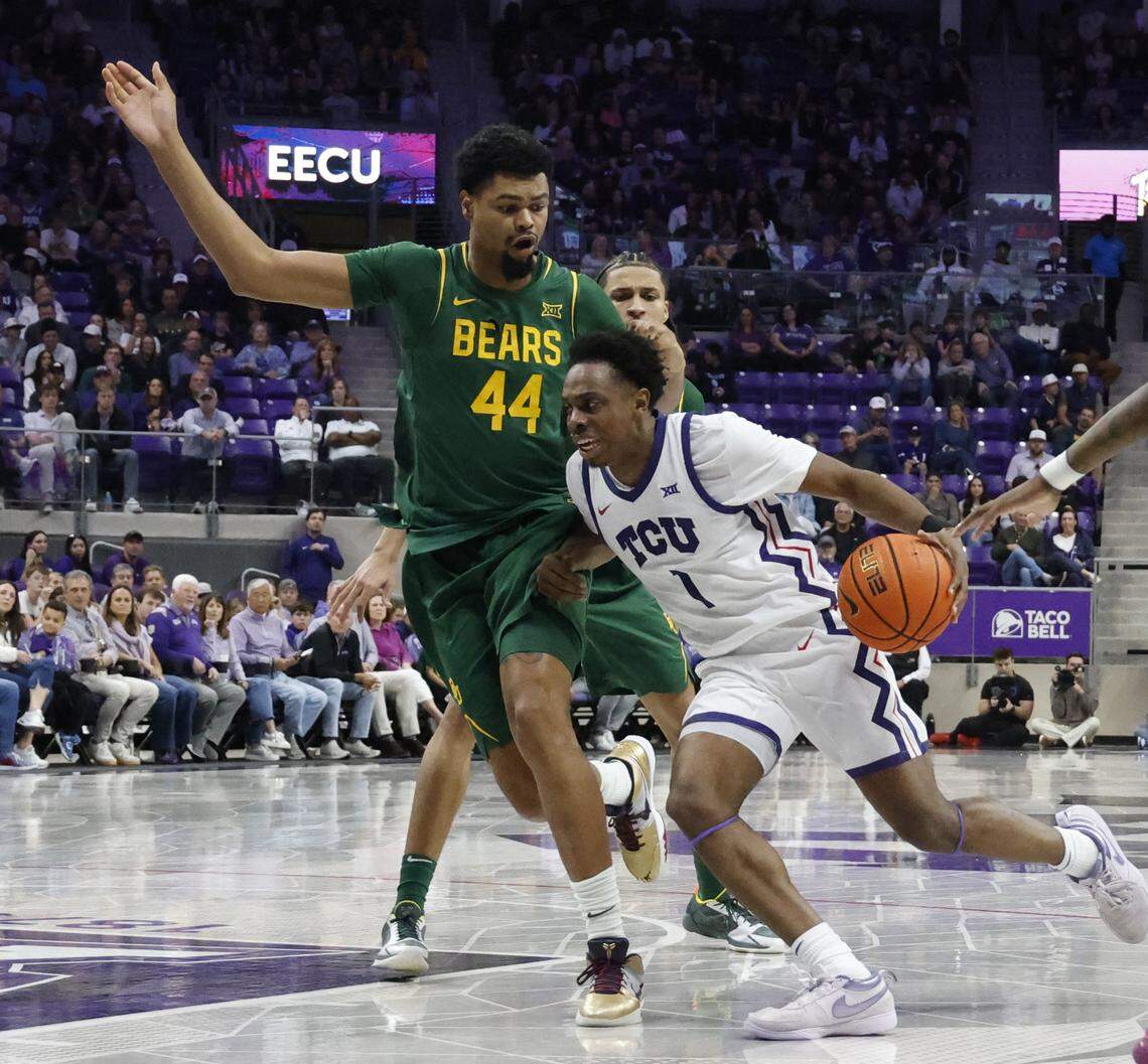 TCU guard Jayden Pierre (1) drives into the key defended by Baylor center Caden Powell (44) during the second half of a NCAA basketball game between Baylor University and TCU at Schollmaier Arena in Fort Worth, Texas, Saturday Jan. 03, 2026