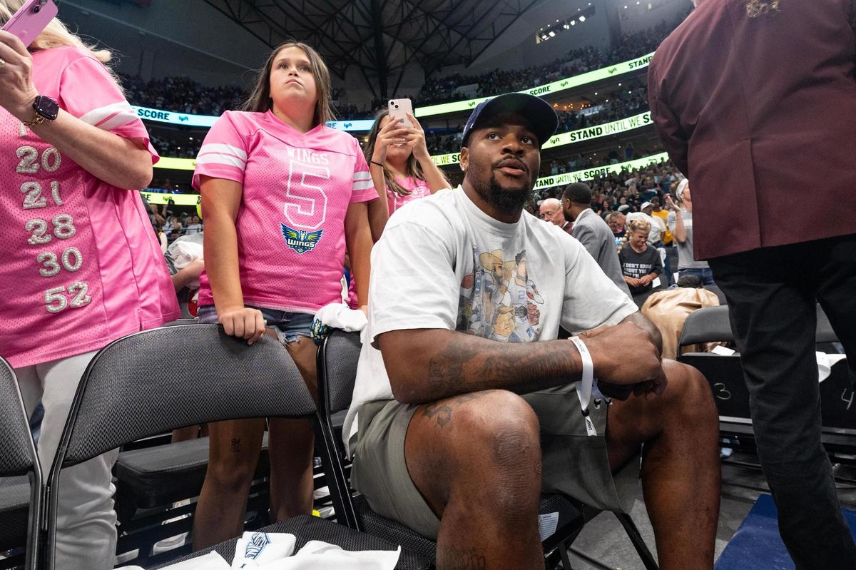 Dallas Cowboys linebacker Micah Parsons sits court side during an WNBA game between the Dallas Wings and Indiana Fever at the American Airlines Center in Dallas on Friday, June 27, 2025.