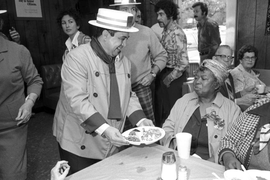 Nov. 26, 1976: Raul Jimenez serves Thanksgiving dinner to Georgia Benton, one of many senior citizens hosted by Raul and Leo Jimenez at their Jimenez Restaurant, 307 W. Central Ave., in Fort Worth’s North Side neighborhood.