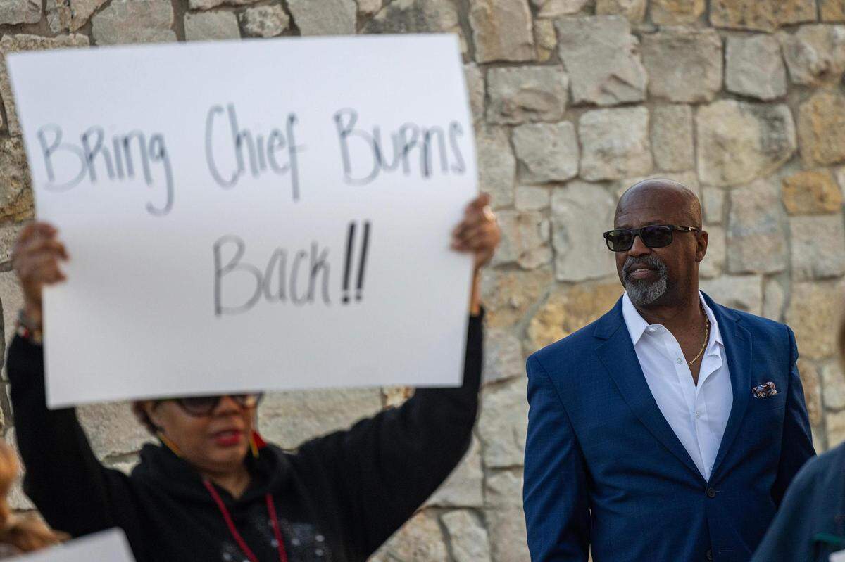 Former Forest Hill Police Chief Eddie Burns Sr., who was fired in February after being on medical leave for months before his termination, looks on at the dozens of residents rallying and holding signs in support of him in front of Forest Hill City Hall on Friday, March 1, 2024.
