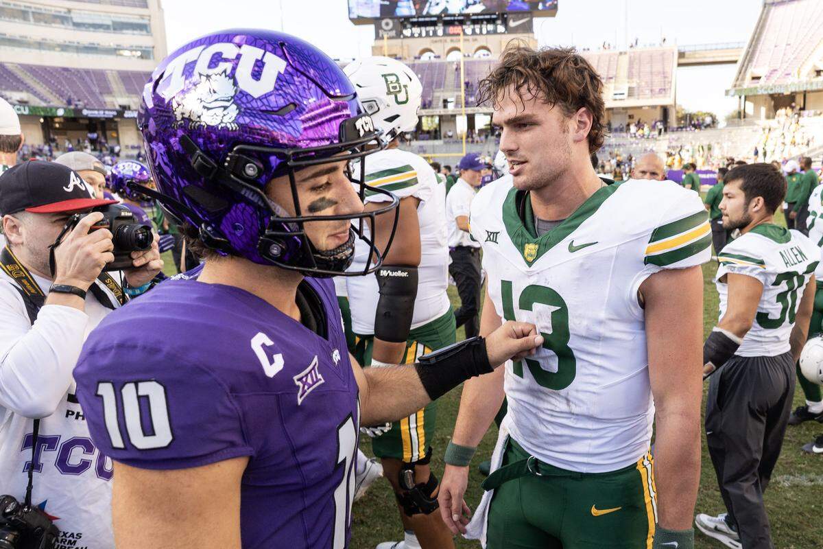 TCU quarterback Josh Hoover (10), left, and Baylor quarterback Sawyer Robertson (13) greet each other after following a Big XII football game between the TCU Horned Frogs and the Baylor Bears at Amon G Carter Stadium in Fort Worth on Saturday, Oct. 18, 2025.