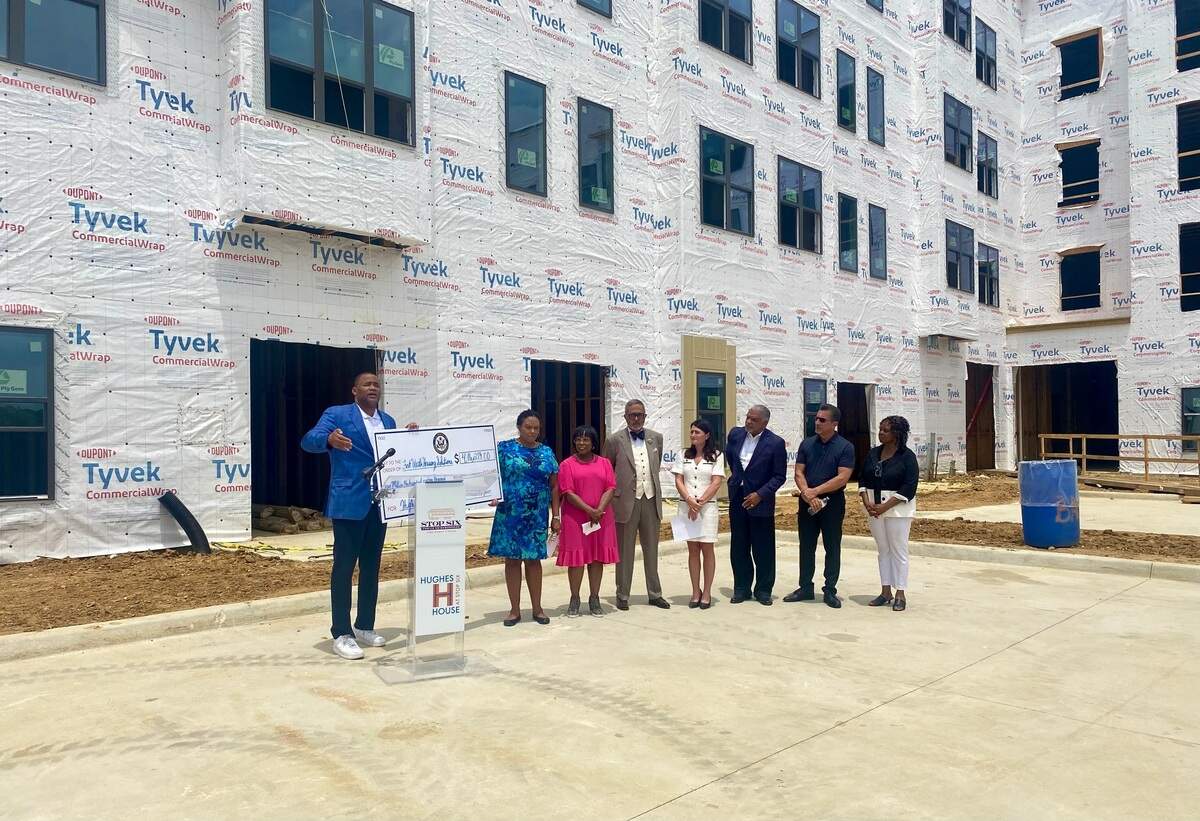 Congressmen Marc Veasey giving a speech to council members and developers of Hughes House II project.