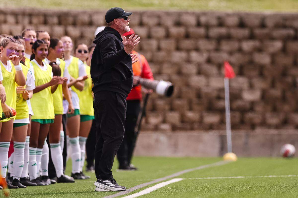 Southlake Carroll head coach Matthew Colvin holds his hands in the air while talking to his players facing Forney in a UIL Class 6A Division 2 girls soccer state semifinal on Saturday, April 4, 2026, at Memorial Stadium in Mesquite, Texas.