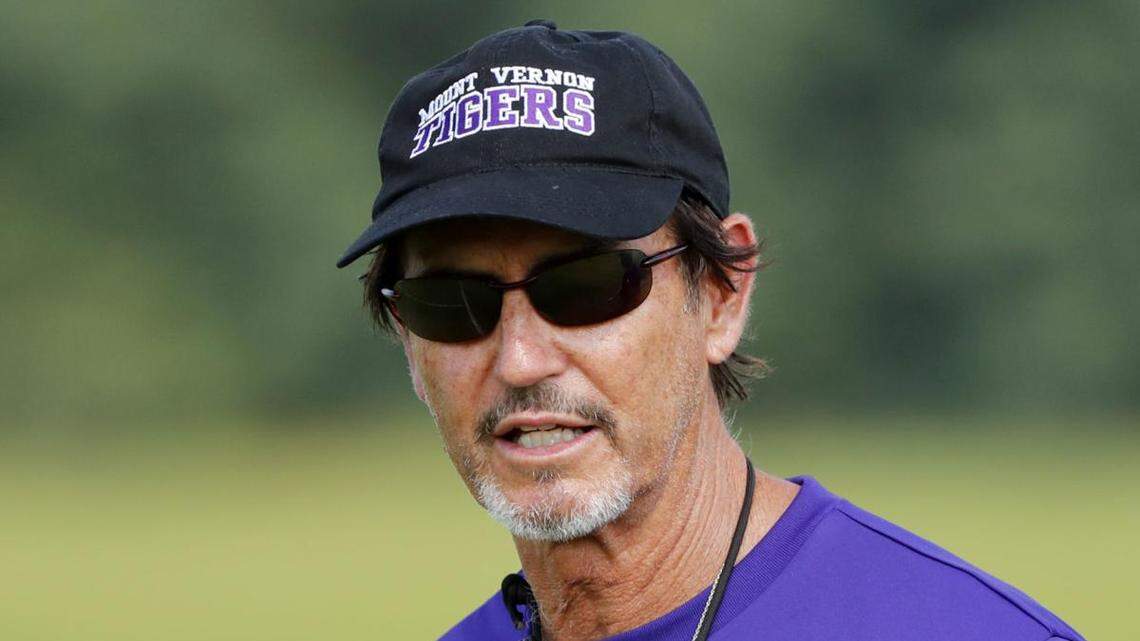 In this AP file photo, coach Art Briles watches his football team practice at Mount Vernon High School on Monday, Aug. 5, 2019, in Mount Vernon, Texas.